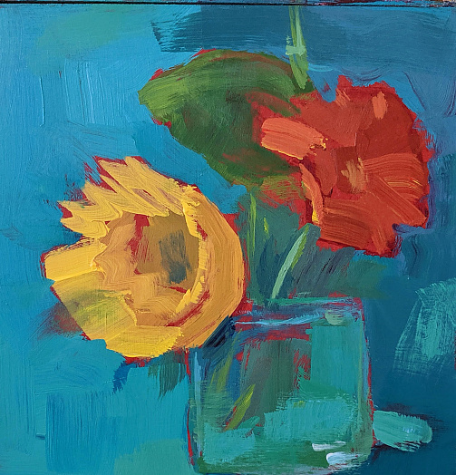 bright sunflowers orange yellow on blue background in vase