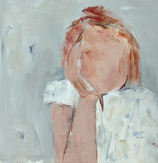 redhead girl resting chin on hand