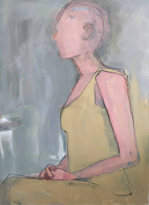 woman sitting sideways with khaki dress